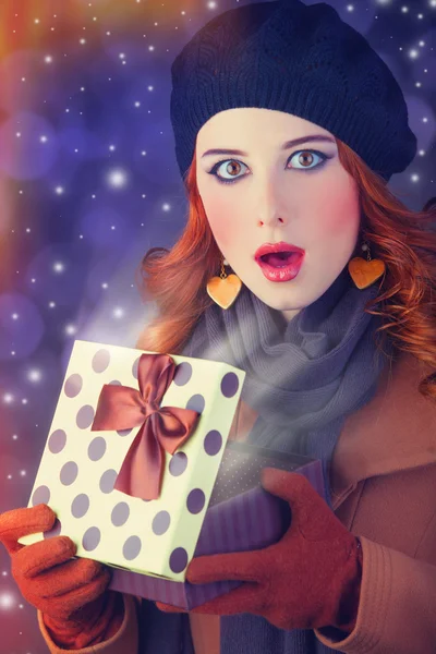 Redhead girl with gift. — Stock Photo, Image