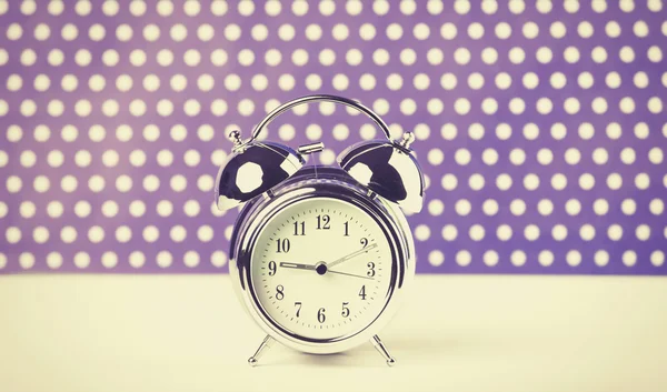 Retro alarm clock on a table — Stock Photo, Image