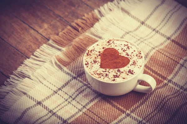 Cup with coffee and scarf. — Stock Photo, Image