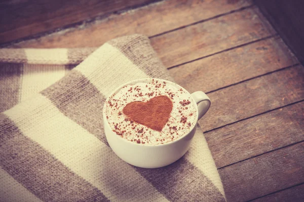 Cup with coffee and scarf. — Stock Photo, Image