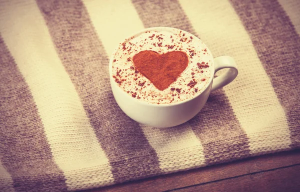 Cup with coffee and scarf. — Stock Photo, Image