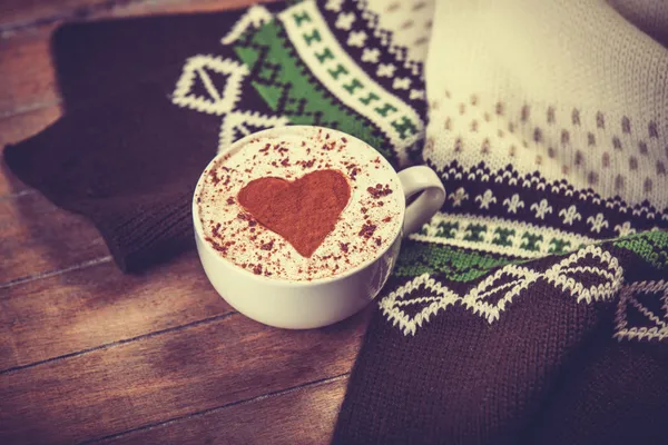 Cup with coffee and scarf. — Stock Photo, Image