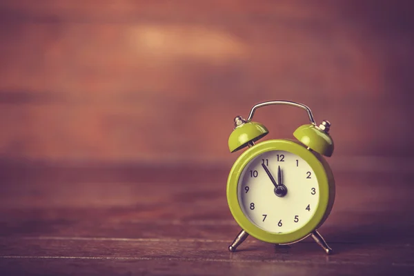 Retro alarm clock on a table — Stock Photo, Image