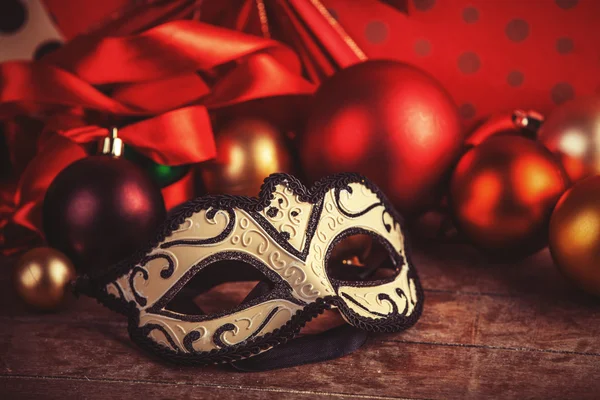 Mask for carnival near gifts. — Stock Photo, Image