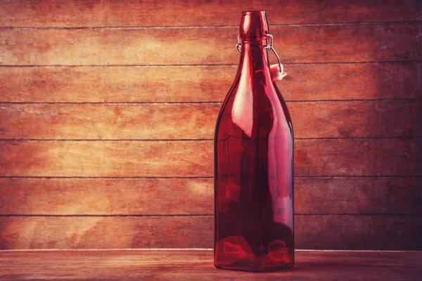 Empty red bottle for a wine. — Stock Photo, Image