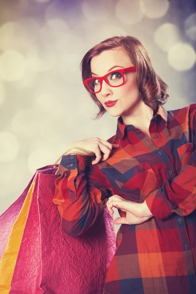 Chica de estilo con bolsas de compras . — Foto de Stock