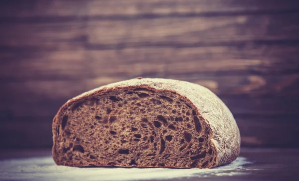 Delicious bread on a wood table — Stock Photo, Image