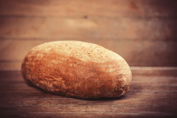 Delicious bread on a wood table — Stock Photo, Image