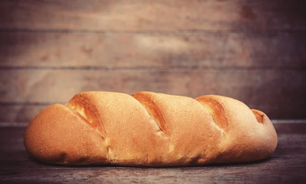 Delicious bread on a wood table — Stock Photo, Image