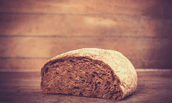 Delicious bread on a wood table — Stock Photo, Image