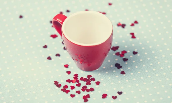 Kopje een koffie op polka dot cover — Stockfoto