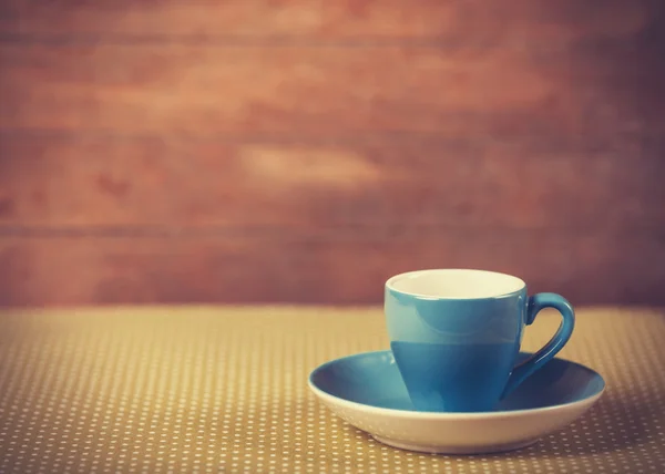 Copa de un café en la cubierta de lunares . — Foto de Stock