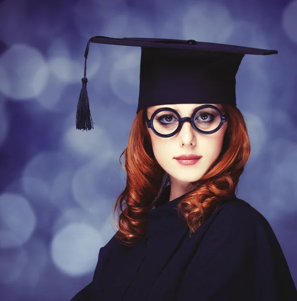 Graduating student girl in an academic gown. — Stock Photo, Image