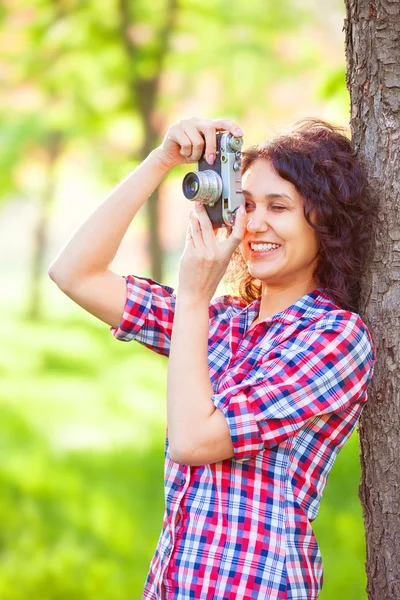 Indian girl with camera in the park. — Stock Photo, Image