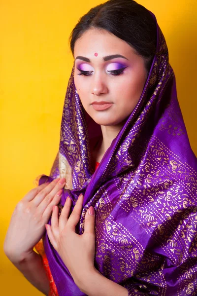 Indian girl on yellow background — Stock Photo, Image