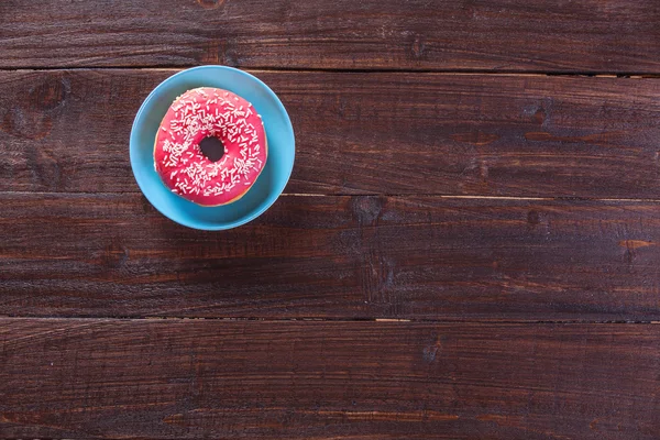 Donut on wooden table. — Stock Photo, Image