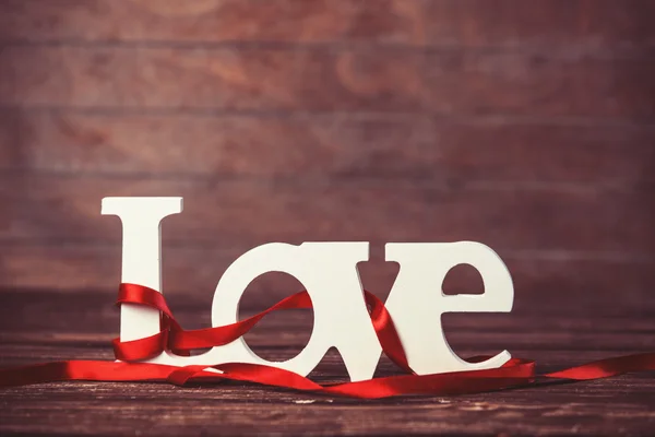 Word love on wooden table. — Stock Photo, Image