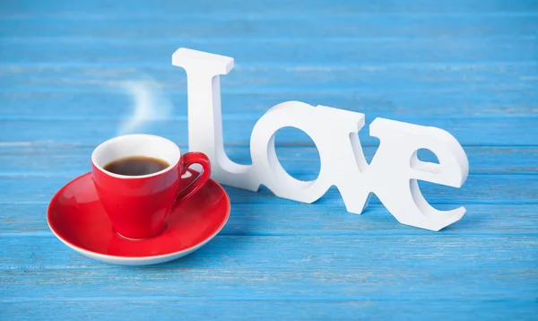 Word love and cup of coffee. — Stock Photo, Image