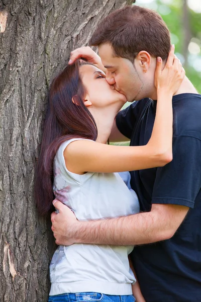 Young teen couple kissing at outdoor Royalty Free Stock Photos