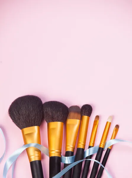 Brushes on pink background. — Stock Photo, Image