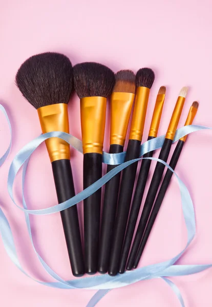 Brushes on pink background. — Stock Photo, Image