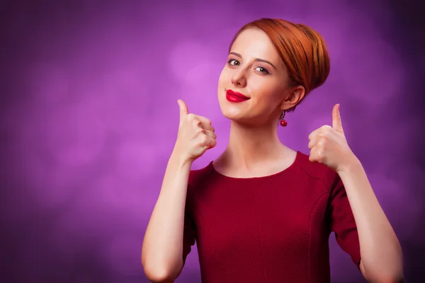 Beautiful redhead women on viloet background. — Stock Photo, Image