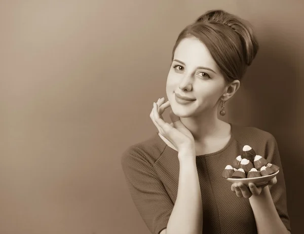 Women with candy. Photo in sepia color image style. — Stock Photo, Image