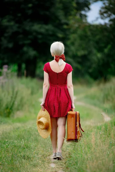 Blonde Lady Beautiful Red Dress Suitcase Hat Countryside Road — Stock Photo, Image