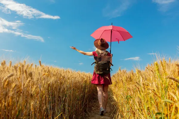 Blonde Girl Hat Red Dress Umbrella Backpack Wheat Field — Stock Photo, Image