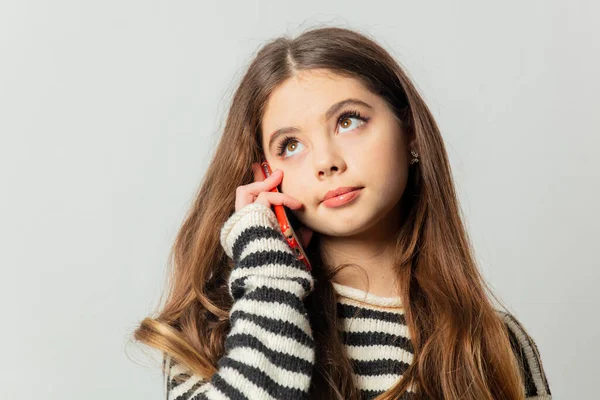 Beautiful Girl Striped Sweater Talking Mobile Phone White Background — Fotografia de Stock