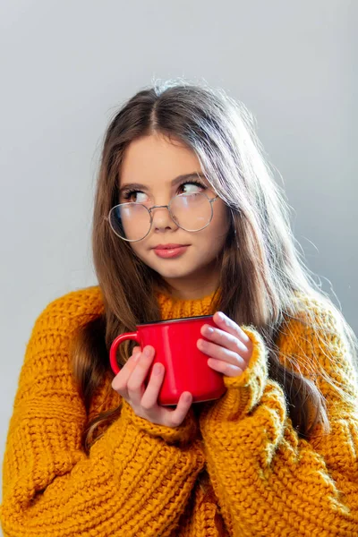 Beautiful Girl Glasses Yellow Sweater Red Mug White Background —  Fotos de Stock
