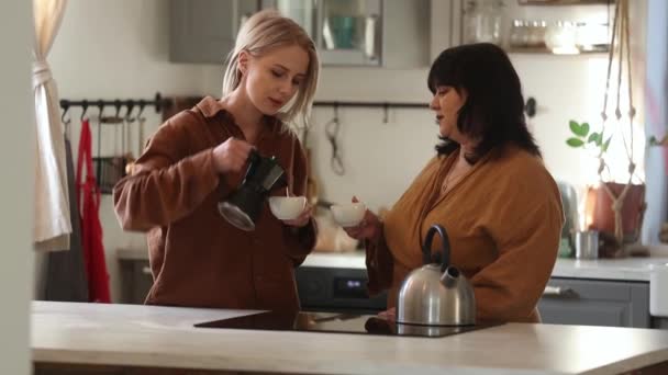 Two Women Mother Daughter Drinking Coffee Kitchen — Stock videók