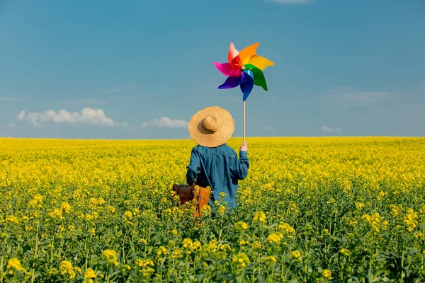 Woman Hat Suitcase Pinwheel Rapeseed Field — Stockfoto