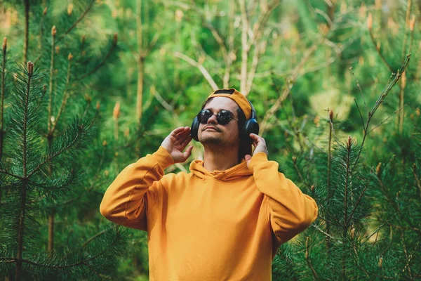 Stylish Man Hoodie Listen Music Headphones Pine Tree Forest — Stockfoto