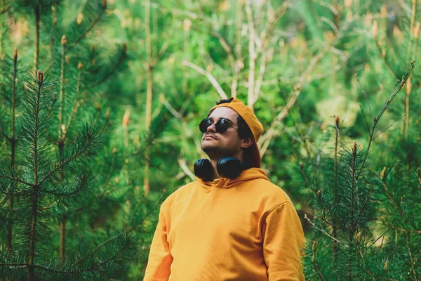 Stylish Man Hoodie Listen Music Headphones Pine Tree Forest — Stock fotografie