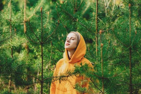 Girl Yellow Hoodie Listening Birds Singing Pine Forest — Stockfoto