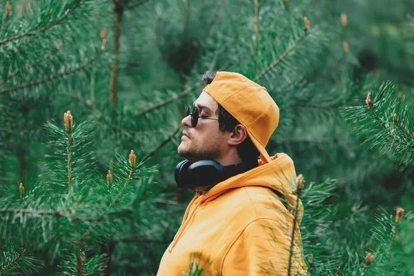 Stylish Man Hoodie Listen Music Headphones Pine Tree Forest — Photo