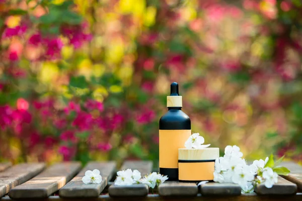 Cosmetic Bottle Jar Wooden Table Blooming Tree Spring Garden — Stock Photo, Image