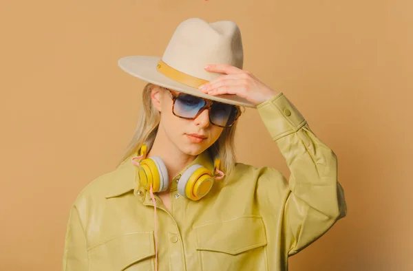 Stylish 80S Woman Eyeglasses Headphones Hat Brown Background —  Fotos de Stock