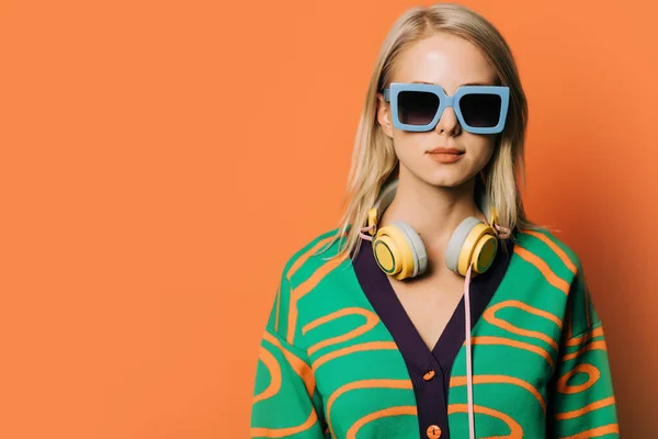 Stylish 80S Woman Eyeglasses Headphones Blouse Orange Background —  Fotos de Stock