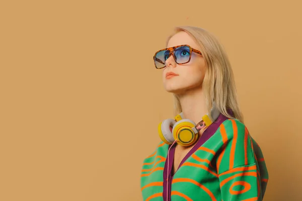 Stylish 80S Woman Eyeglasses Headphones Brown Background — 图库照片
