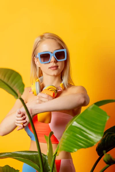 Stylish Blond Woman Colored Swimming Suit Sun Cream Yellow Background — ストック写真