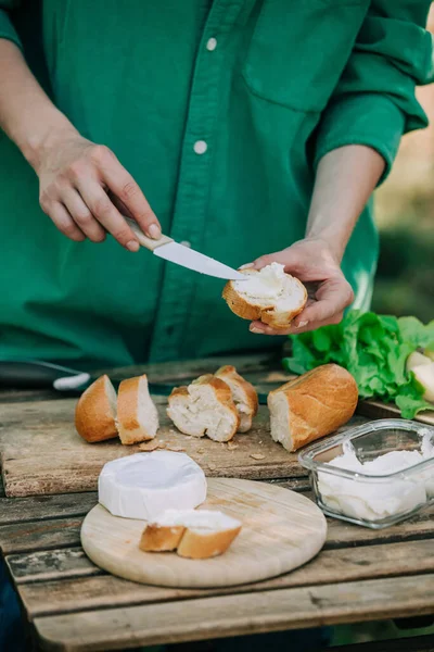 Stylish Woman Green Shirt Make Snack Bread Cheese Table Outdoor — 图库照片