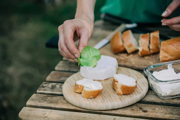 Stylish Woman Green Shirt Make Snack Bread Cheese Table Outdoor — Zdjęcie stockowe