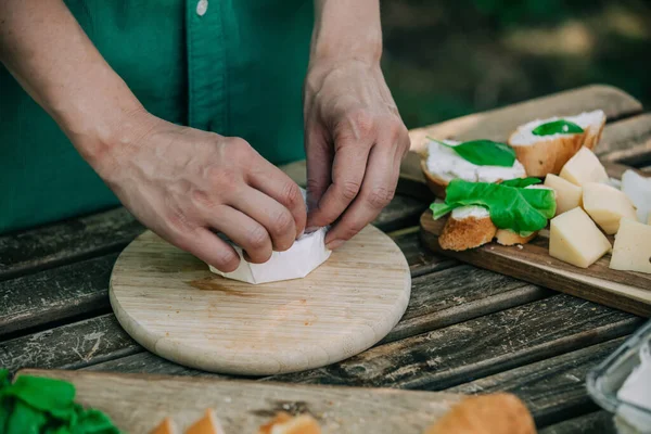 Stylish Woman Green Shirt Make Snack Bread Cheese Table Outdoor —  Fotos de Stock