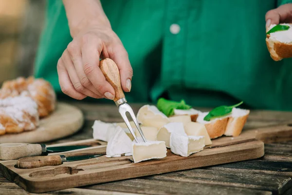 Stylish Woman Green Shirt Stabs Cheese Snack Fork — Zdjęcie stockowe