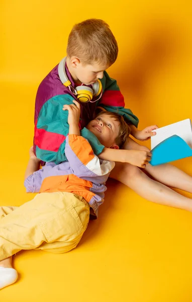 Two Kids 80S Stylish Clothes Play Yellow Background — Zdjęcie stockowe