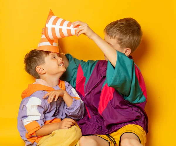 Two Kids 80S Stylish Clothes Play Yellow Background — Zdjęcie stockowe