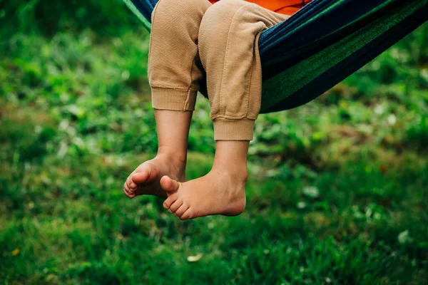 Closeup View Boy Legs Who Sit Hammock Outdoor — стоковое фото