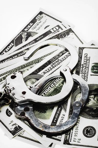 Handcuffs and money — Stock Photo, Image